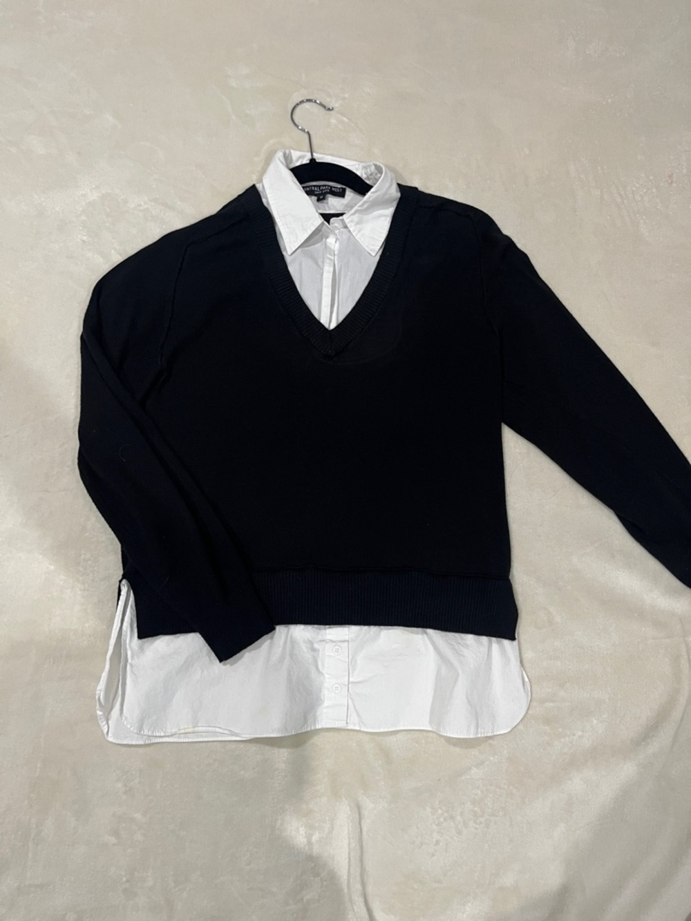 Central Park West Black V-Neck Sweater with White Shirt Detail